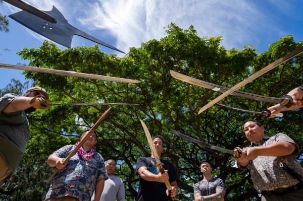 Members of Hawaii Firearms Coalition showcase their halberd, swords and balisong at Kapiolani Park on Saturday, June 22, 2024, in Honolulu, Hawaii.